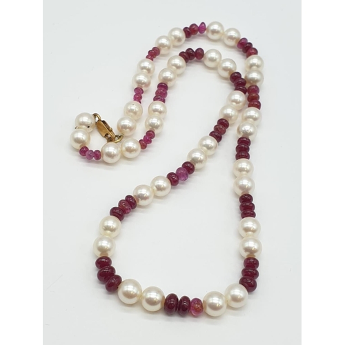 715 - Ruby and Cultured Pearl NECKLACE.  9ct Gold Clasp.   23g    40cm