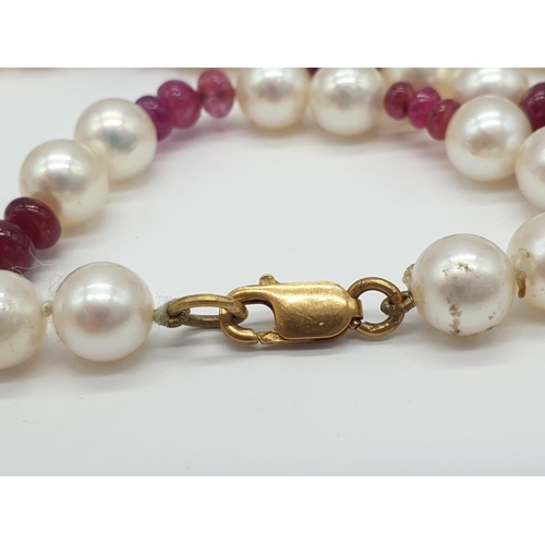 715 - Ruby and Cultured Pearl NECKLACE.  9ct Gold Clasp.   23g    40cm