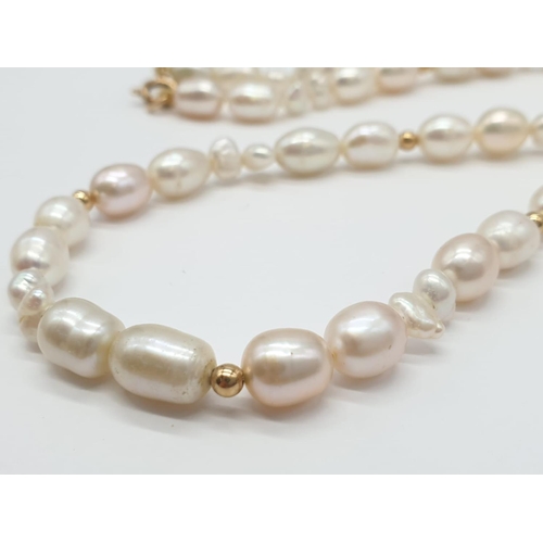 722 - Freshwater Pearl and 9ct Gold NECKLACE.  27.1g   42cm