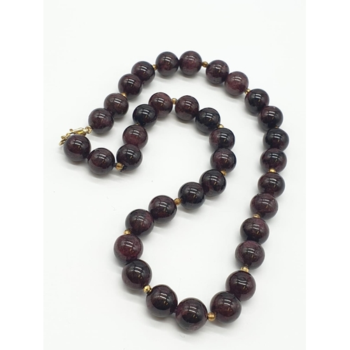 729 - Garnet NECKLACE with 9ct Gold Clasp.   98g  38cm