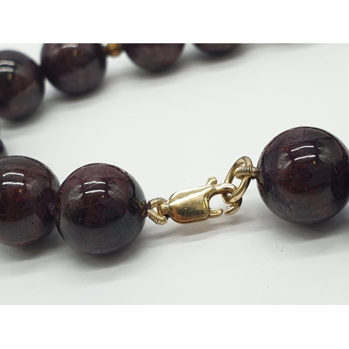 729 - Garnet NECKLACE with 9ct Gold Clasp.   98g  38cm