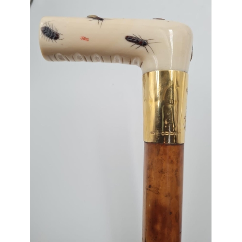 290 - AN ANTIQUE VICTORIAN WALKING STICK WITH CARVED IVORY HANDLE AND 18CT GOLD BAND.
92CMS IN HEIGHT