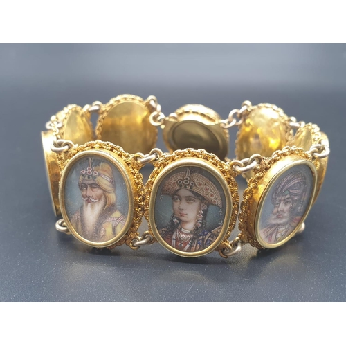 262 - AN INDIAN 19TH CENTURY 22CT GOLD PORTRAIT BRACELET. 43 1gms  and 19cms long.