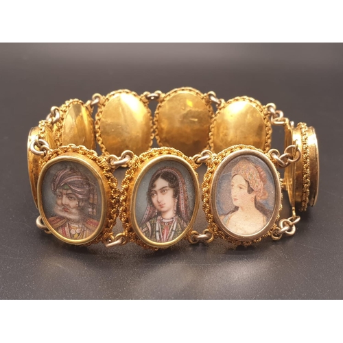 262 - AN INDIAN 19TH CENTURY 22CT GOLD PORTRAIT BRACELET. 43 1gms  and 19cms long.