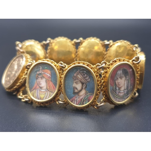 262 - AN INDIAN 19TH CENTURY 22CT GOLD PORTRAIT BRACELET. 43 1gms  and 19cms long.