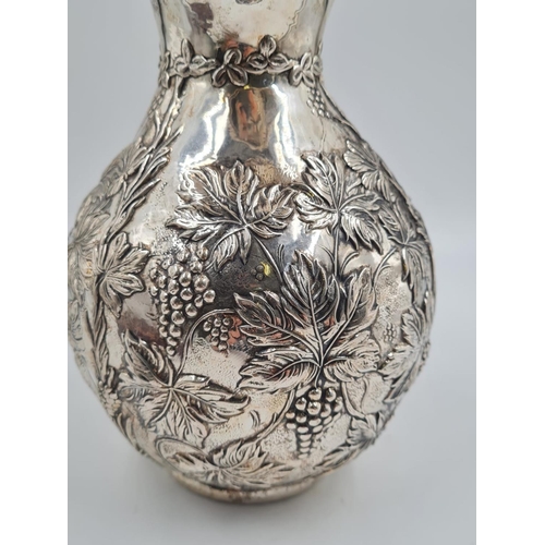 178 - A LARGE SPANISH SILVER WATER JUG HAND FASHIONED CIRCA 1920. 474.4 gms and 27cms TALL