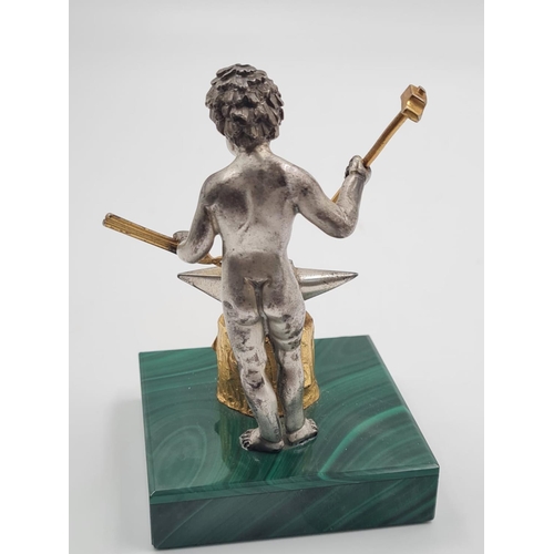 171 - A 20TH CENTURY ITALIAN SILVER AND MALACHITE FIGURINE OF A NAKED BLACKSMITH STANDING 10CMS TALL AND W... 