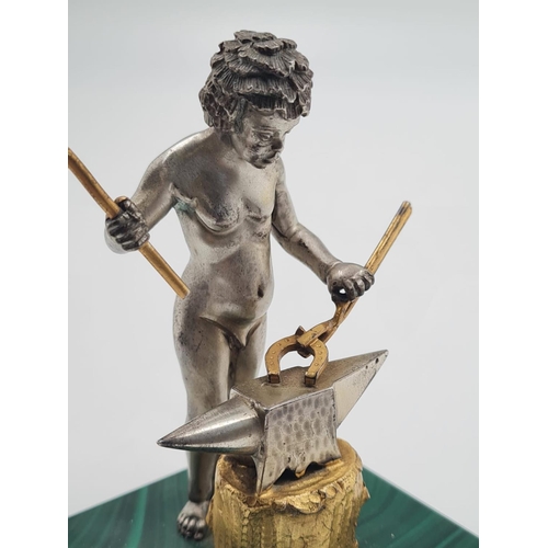 171 - A 20TH CENTURY ITALIAN SILVER AND MALACHITE FIGURINE OF A NAKED BLACKSMITH STANDING 10CMS TALL AND W... 