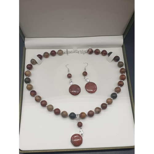 764 - A rare silver and jasper necklace and earrings set with fossil red horn corals (300 million years ol... 