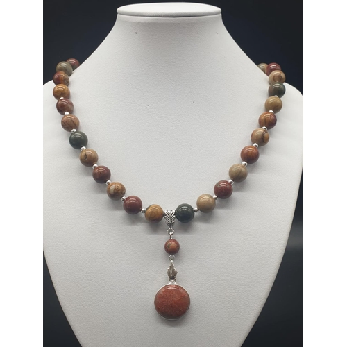 764 - A rare silver and jasper necklace and earrings set with fossil red horn corals (300 million years ol... 