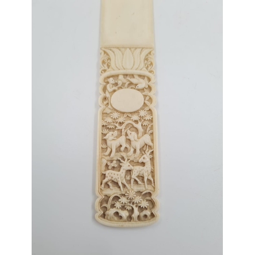 778 - An Antique 17th Century Ivory Letter Opener with hunting dogs and deer hand-carved decoration.
27cm ... 