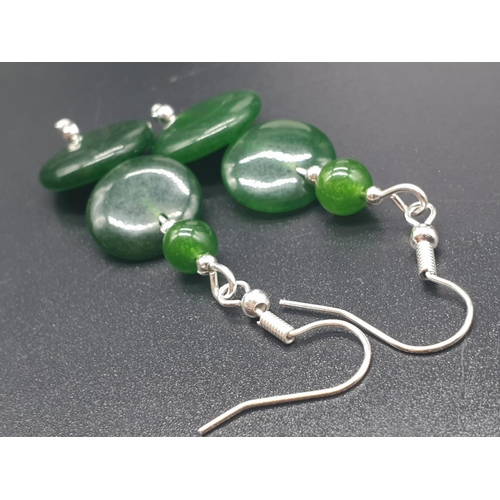 797 - A modern spinach green jade necklace, bracelet and earrings set in a presentation box. Necklace leng... 