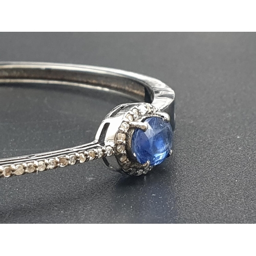 153 - 925 Silver bangle set with 3 Oval cut Kyanites & 92 Rose cut diamonds of approx 3cts
W.G.I (World Ge... 