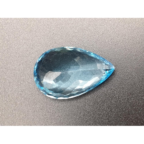 174 - A very large 29.30cts pear shaped Blue Topaz stone with W.G.I (World Gemmological Institute) UK Cert... 