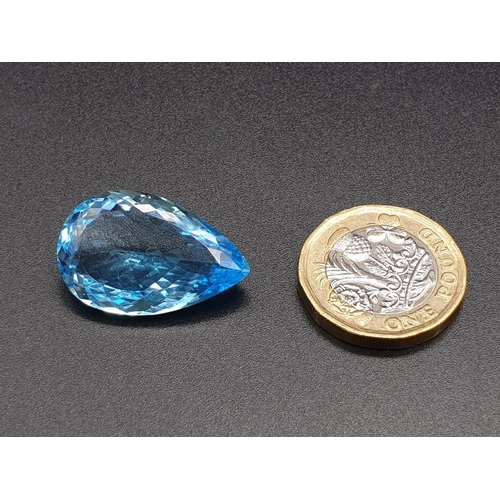 174 - A very large 29.30cts pear shaped Blue Topaz stone with W.G.I (World Gemmological Institute) UK Cert... 