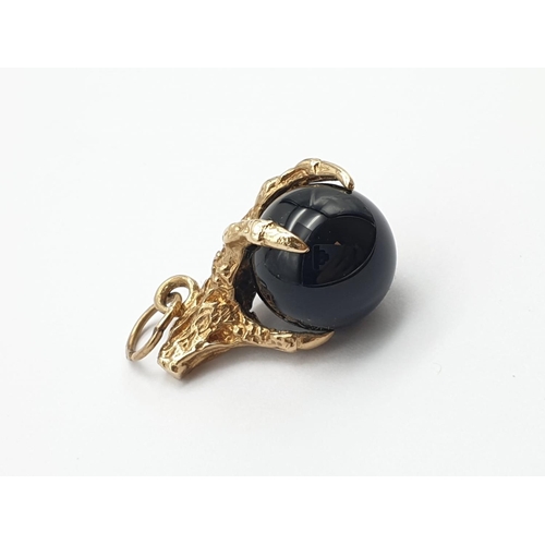 195 - 9K Gold Eagle Claw Charm, holding Black Onyx Ball.
4.91g total weight.