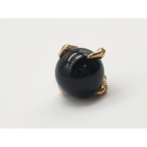 195 - 9K Gold Eagle Claw Charm, holding Black Onyx Ball.
4.91g total weight.