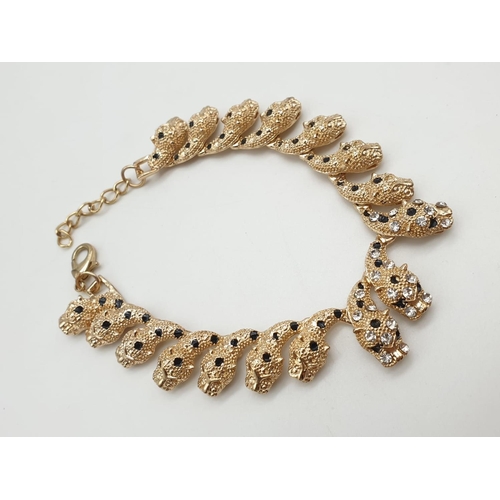 246 - A very glamorous, Cartier Panther style, gold plated complete set, consisting of necklace, bracelet,... 