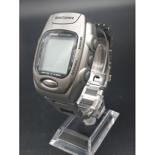 302 - A Rare Casio Wrist WQV-1 Camera Watch. Stainless Steel strap. Comes with all original paperwork. Inf... 