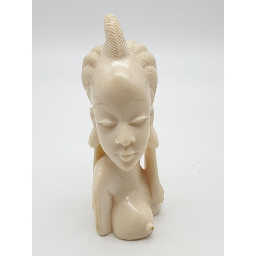 396 - An Antique Hand-Carved Ivory Figure of a Tribal African Woman. 13cm tall. 286g.