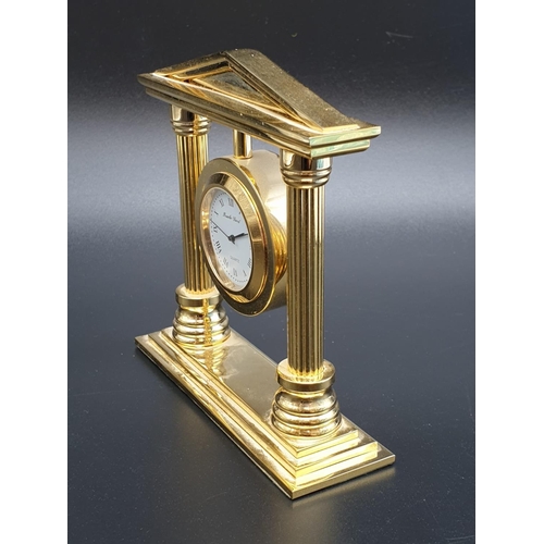 423 - A Bueche-Girod marked Gold-Tone Temple-Style Clock.
As found, 10x 10cm