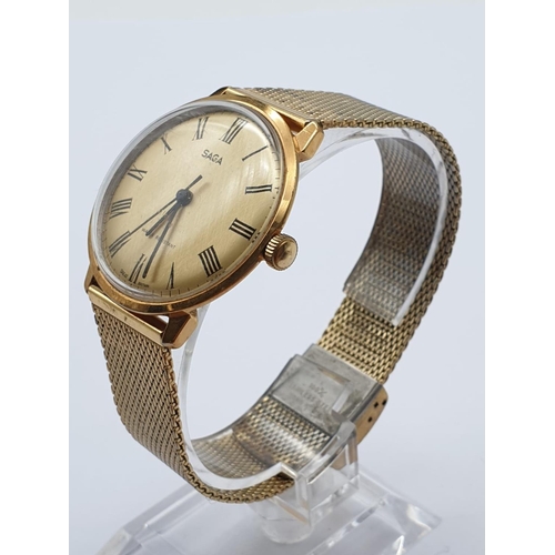 447 - Vintage Saga Men's Wristwatch. Gold Plated Strap and Case, Gold Dial. In Full Working Order.