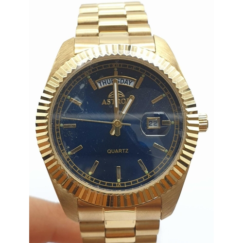 487 - Astron Gold Plated Watch. Blue Dial, Day and Date. As New, In Box. As Found - needs new battery.