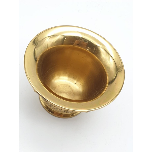 520 - A very ornate, Asian, brass, mortar and pestle. Weight: 868g.