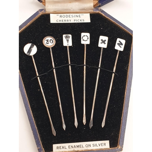 785 - A Boxed Set of 1930s Six Silver Rodesine Cherry Picks with Enamel Tops. In original box. 18.2g total... 