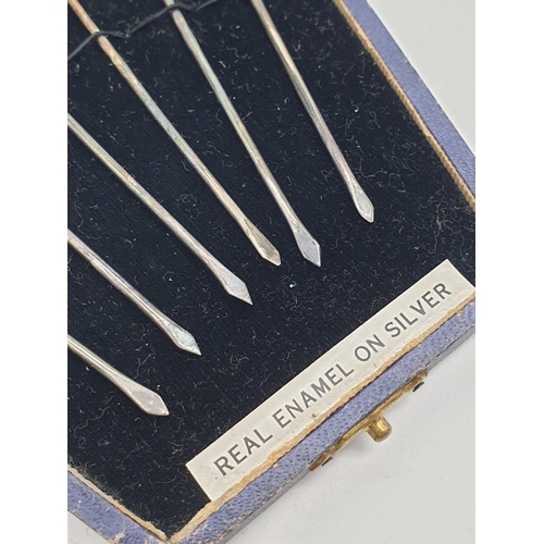 785 - A Boxed Set of 1930s Six Silver Rodesine Cherry Picks with Enamel Tops. In original box. 18.2g total... 