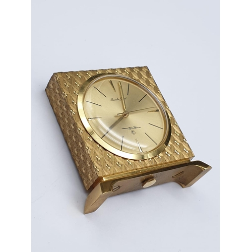 890 - A Bueche Girod marked Gold Tone Miniature Clock.
As found. 4 x 4cm