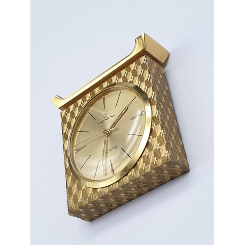 890 - A Bueche Girod marked Gold Tone Miniature Clock.
As found. 4 x 4cm