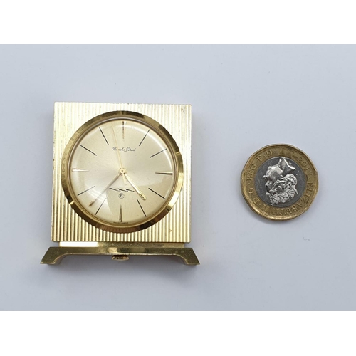 931 - A Bueche-Girod marked Gold-Tone Miniature Clock.
As found. 4 x4cm.