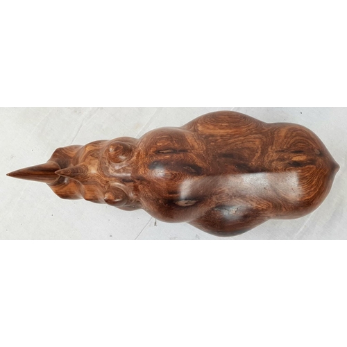 218 - A HAND CRAFTED TEAK RHINO WITH BEAUTIFUL SMOOTH FINISH.(REPAIR TO ONE HIND LEG)