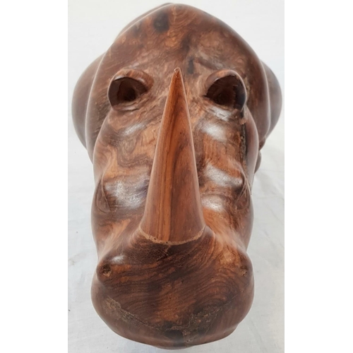 218 - A HAND CRAFTED TEAK RHINO WITH BEAUTIFUL SMOOTH FINISH.(REPAIR TO ONE HIND LEG)