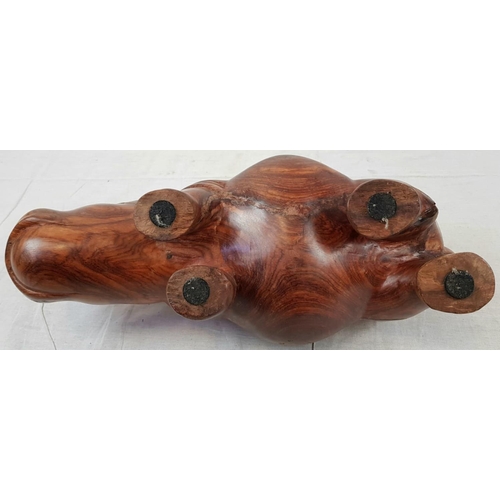 218 - A HAND CRAFTED TEAK RHINO WITH BEAUTIFUL SMOOTH FINISH.(REPAIR TO ONE HIND LEG)