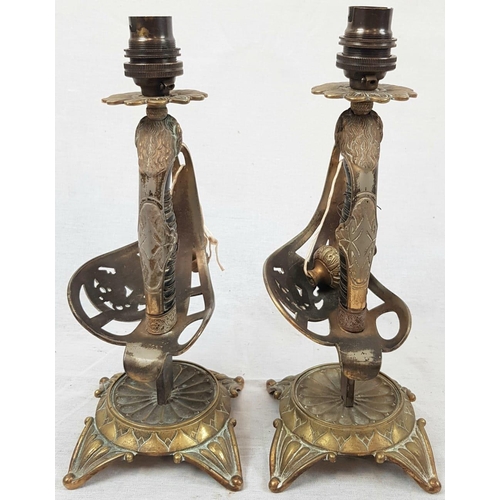 288 - A pair of swords converted into lamp stands with Murano glass, tulip shape, lamp shades. The pair is... 