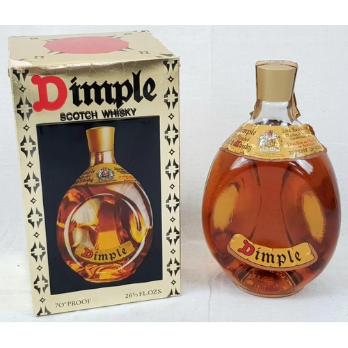 869 - Bottle of Dimple Scotch Whisky. 26 2/3 Fl. OZs. Comes in Original Box.