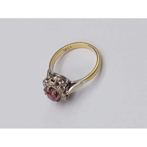 194 - 18k yellow gold ring with ruby centre and diamond surrounds, size O weight 4.3g