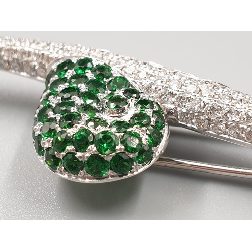 66 - Mappin & Webb 18k white gold brooch in the shape of a snail set in diamonds and tsavorite stones, we... 