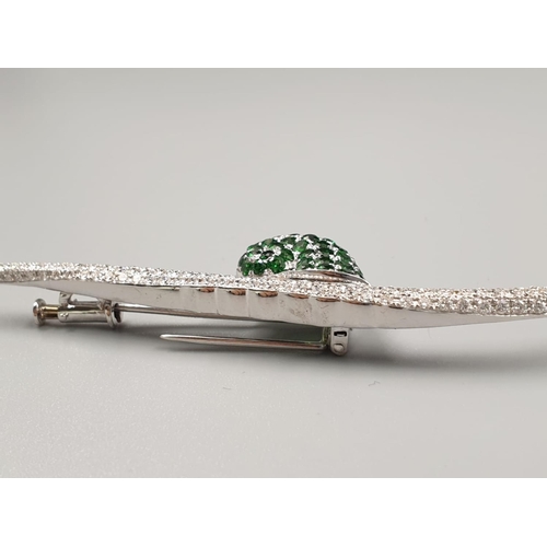 66 - Mappin & Webb 18k white gold brooch in the shape of a snail set in diamonds and tsavorite stones, we... 