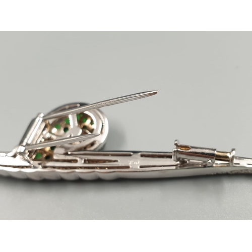 66 - Mappin & Webb 18k white gold brooch in the shape of a snail set in diamonds and tsavorite stones, we... 