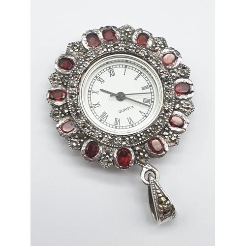 683 - Quartz clock pendant set it garnet and silver, weight 17.9g and 5cm drop approx