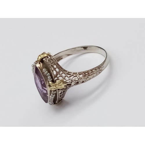 134 - Vintage 14k yellow gold ring with boat shaped amethyst centre and seed pearl decoration with filigre... 