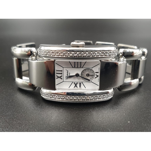 42 - A CHOPARD OF GENEVA LADIES WRIST WATCH WITH DIAMOND ENCRUSTED SHOULDERS, AS NEW.
QUARTZ MOVEMENT 24m... 