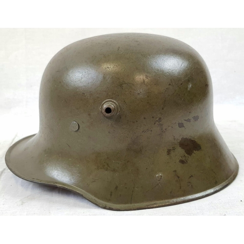 71 - WW1 German M16 Stahlhelm Helmet with liner and original paint. Unusual field repair to one of the ch... 