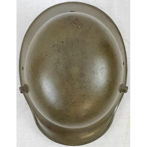 71 - WW1 German M16 Stahlhelm Helmet with liner and original paint. Unusual field repair to one of the ch... 