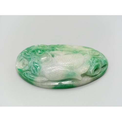 289 - Very large jade pendant with hand carved decoration on both sides, weight 106g