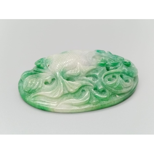 289 - Very large jade pendant with hand carved decoration on both sides, weight 106g