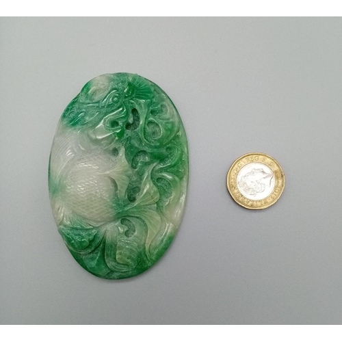 289 - Very large jade pendant with hand carved decoration on both sides, weight 106g